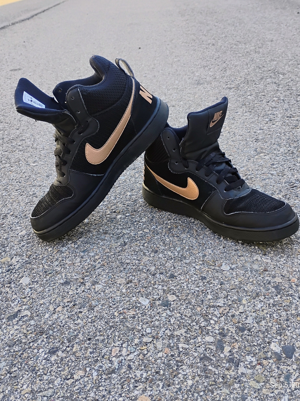 Nike Black High-Top Sneakers with Metallic Rose Gold Swoosh